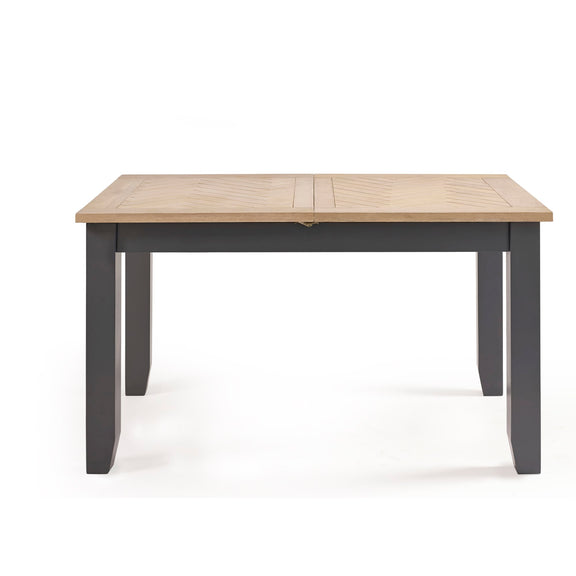 Extendable dining table with oak effect tabletop and black wooden legs