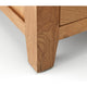 Close-up of a wooden drawer corner on a white background