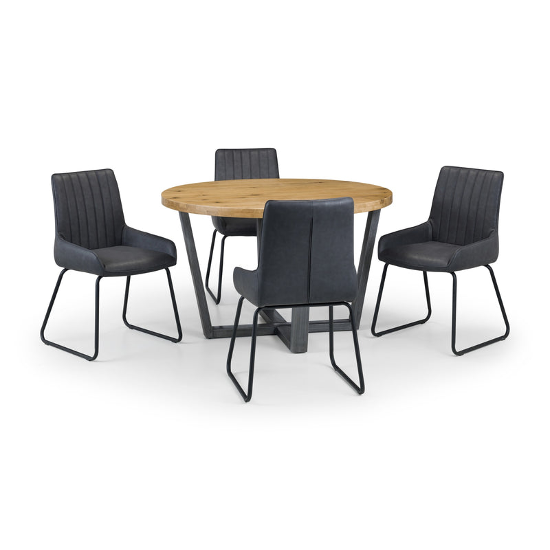 Round wooden table with four black chairs on a white background