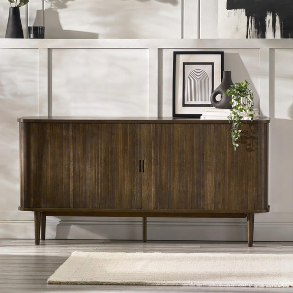 Wooden sideboard in a modern interior setting with decor elements.