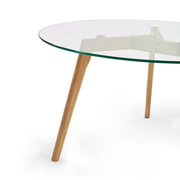 Glass coffee table with wooden legs on a white background