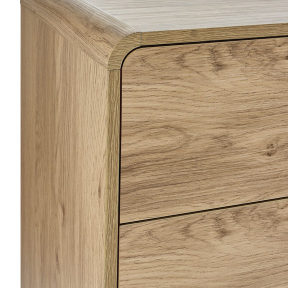 Close-up of a wooden drawer with a light wood finish.