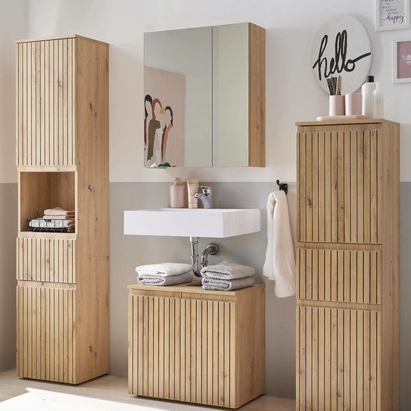 Bathroom setup with wooden cabinets and a mirror