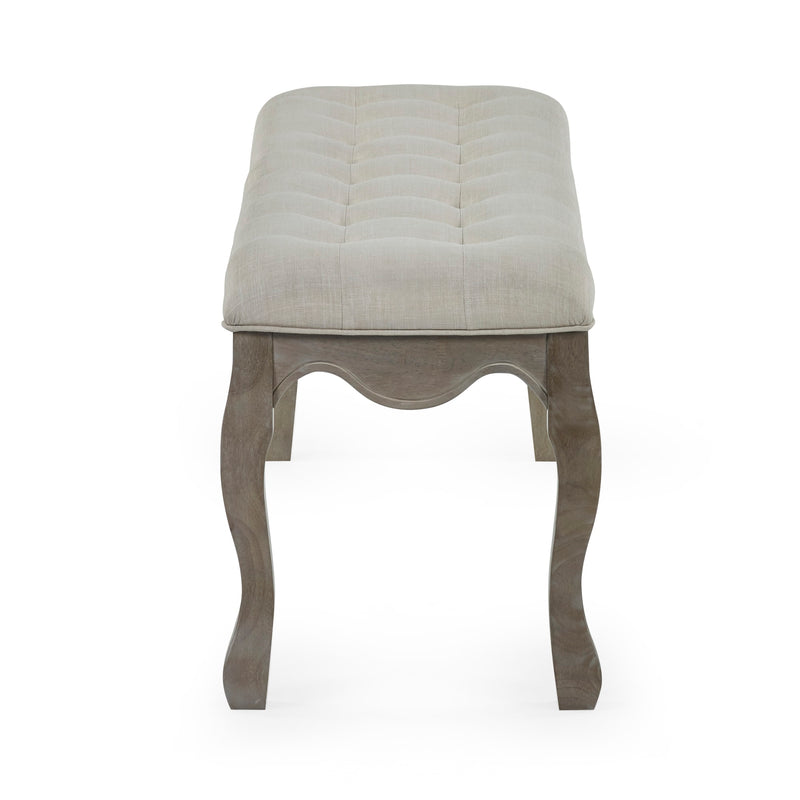Stool with quilted beige top and wooden legs on a white background