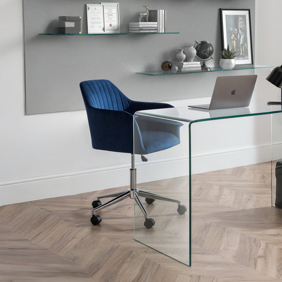 Modern office setup with a glass desk, blue chair, and laptop.