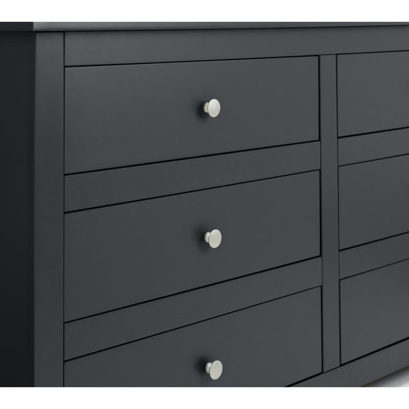 Dark gray dresser with silver knobs on a white background