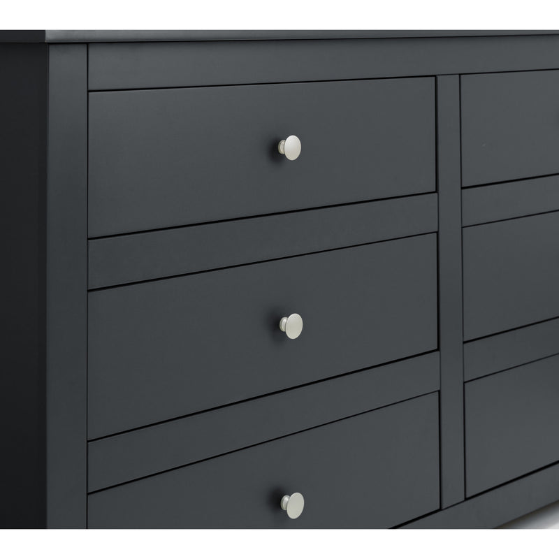Dark gray dresser with silver knobs on a white background