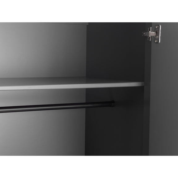Close-up of a kitchen cabinet with a metallic finish and visible hinge.
