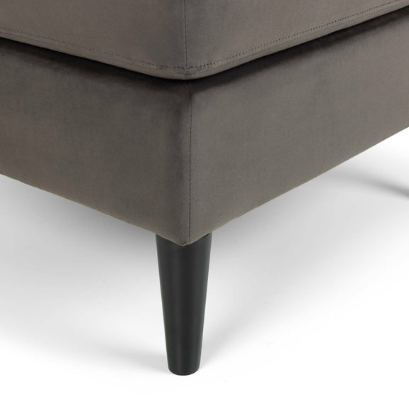 Gray upholstered chair with a black leg on a white background