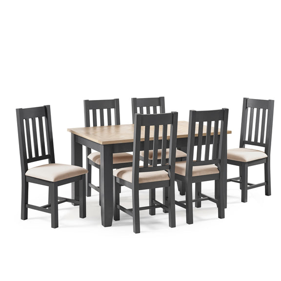Dining table set with six chairs on a white background