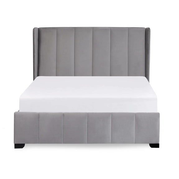 Gray upholstered bed with white mattress on a light gray background