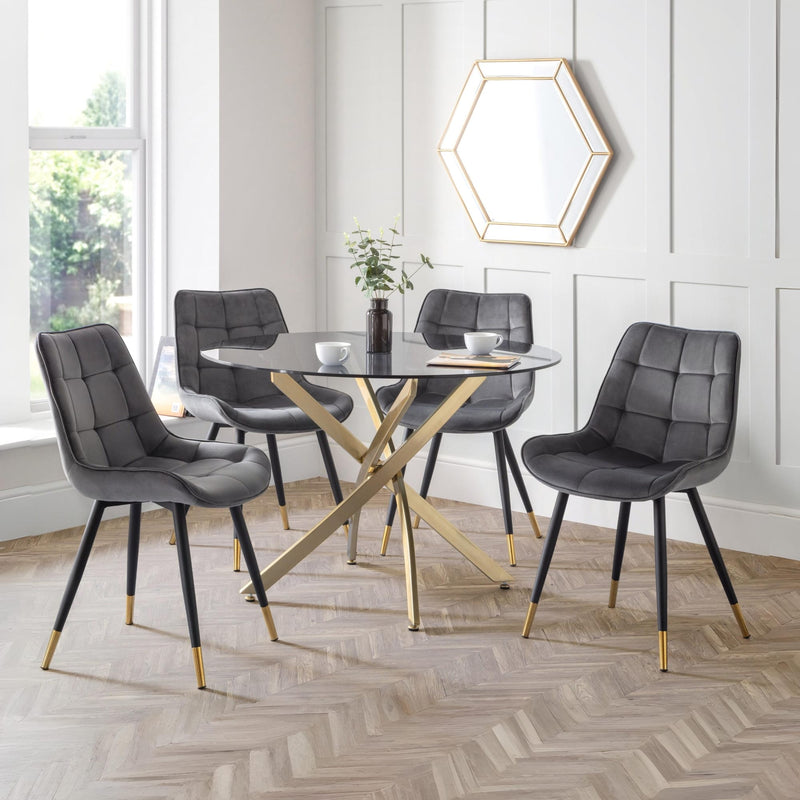Dining room with gray chairs and a glass table.