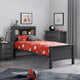 Children's bedroom with gray bed frame, red bedding, and sports-themed decor.