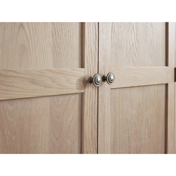 Wooden cabinet with two doors and a handle on a white background