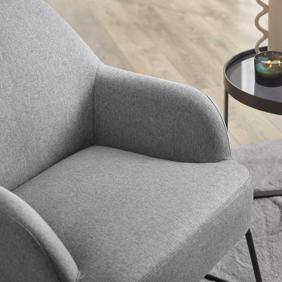 Gray armchair in a room with a blurred background