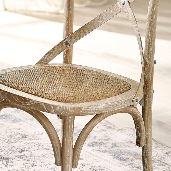 Wooden chair with wicker seat on a marble surface