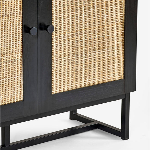 Black cabinet with wicker doors on a white background