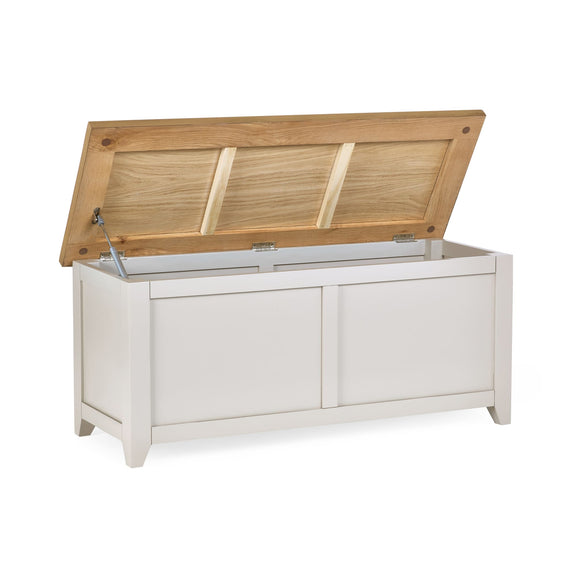 White storage bench with a wooden lid on a white background