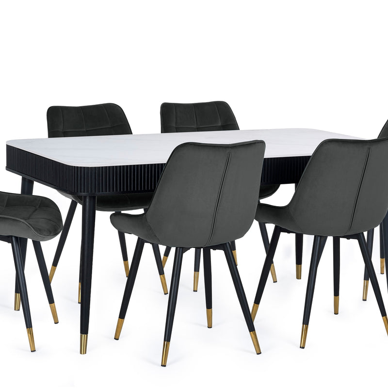 Dining table with black chairs on a white background
