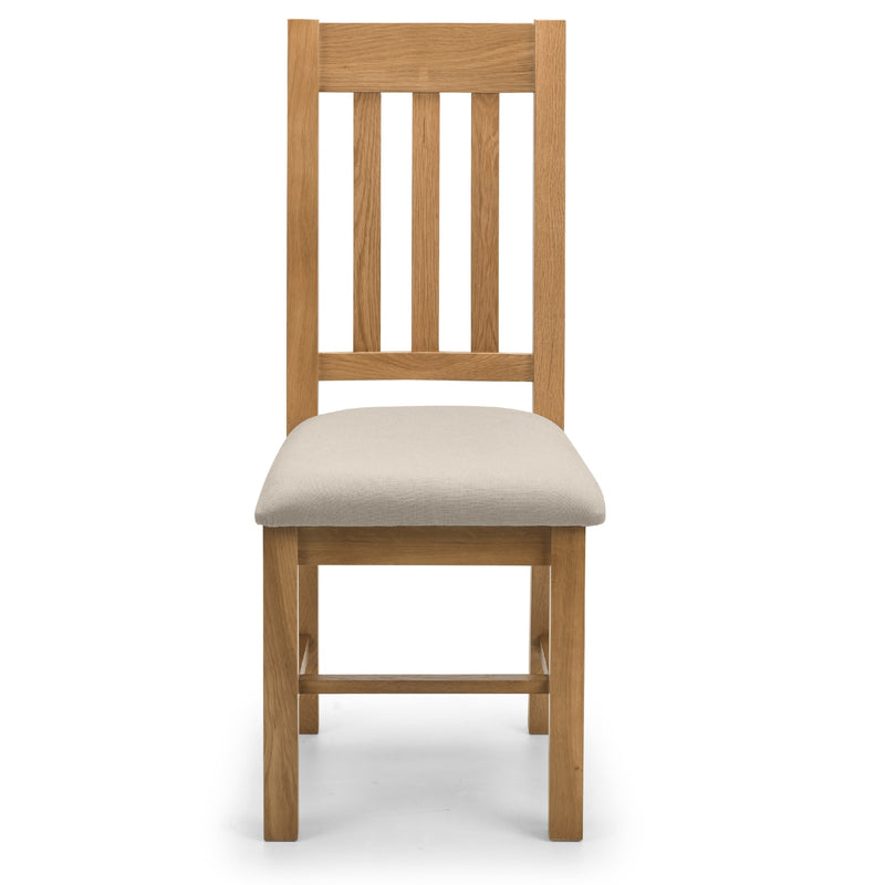 Wooden chair with a beige cushion on a white background