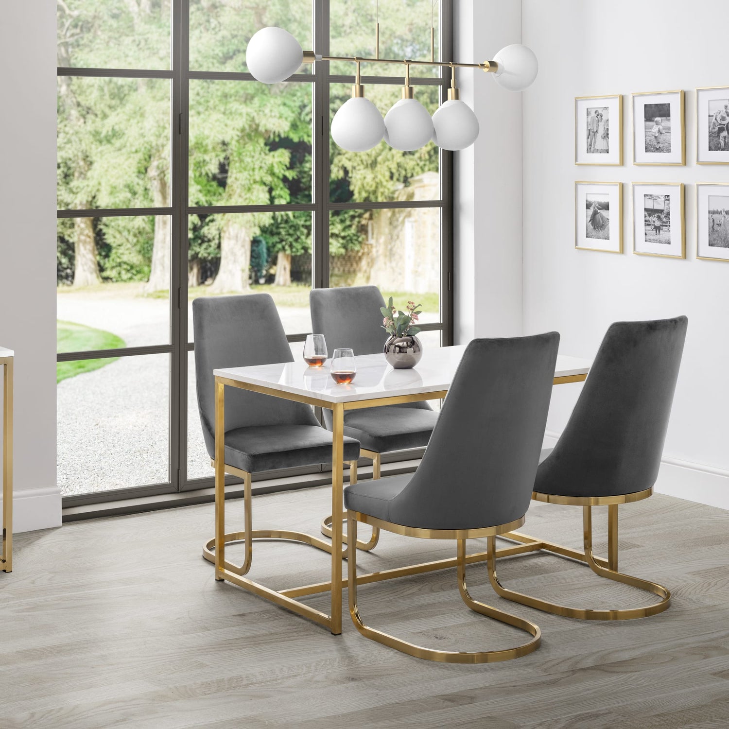 Dining room with a table and chairs near a large window