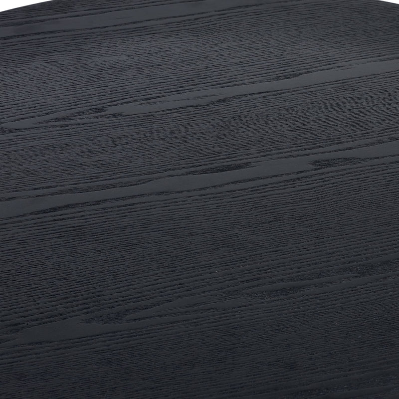 Close-up of a dark wooden surface with visible grain.