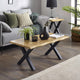 Living room with a wooden coffee table, gray sofa, and decorative items.
