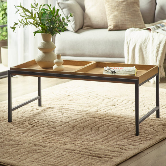 Coffee table with decorative items in a living room setting