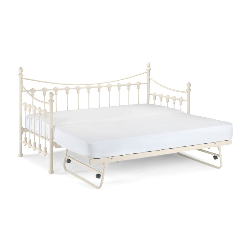 White metal bed frame with a mattress on a white background