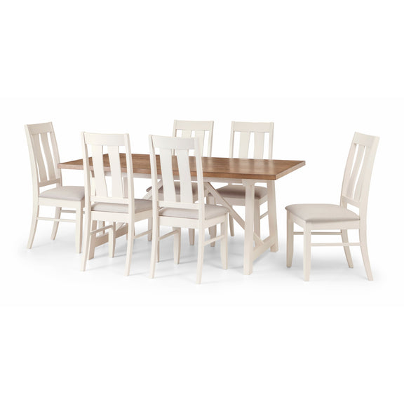 Dining table set with six white chairs on a white background
