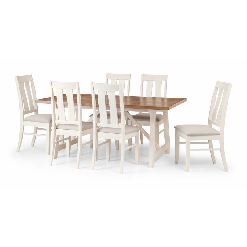 Dining table set with six white chairs on a white background