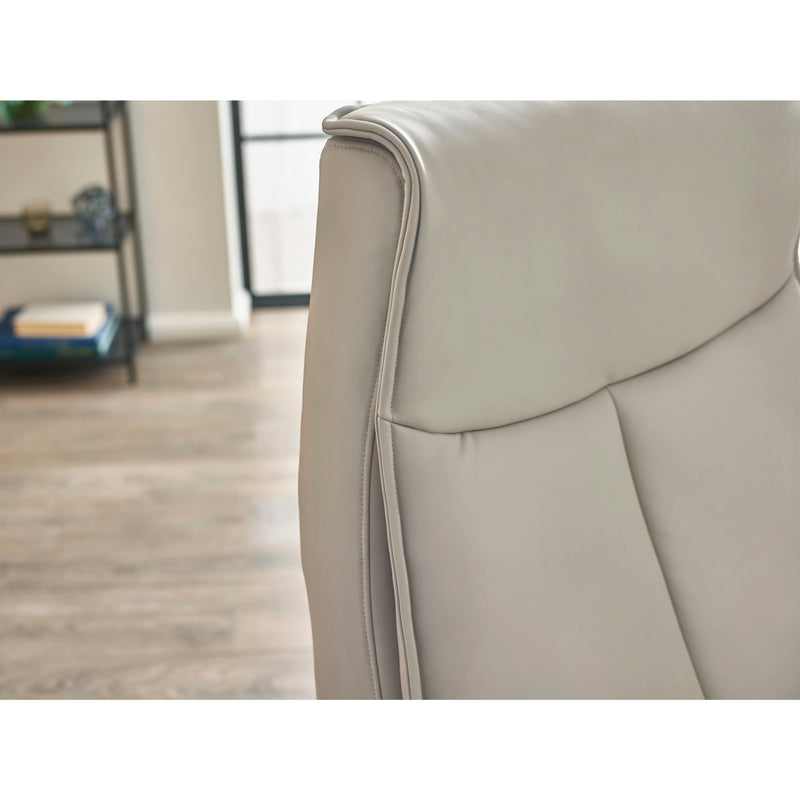 Gray armchair with a blurred background of a room.