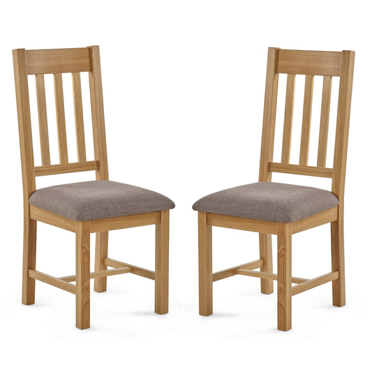 Two wooden chairs with fabric seats on a white background