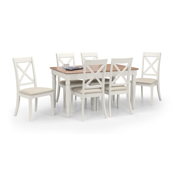 Dining table set with six white chairs on a white background