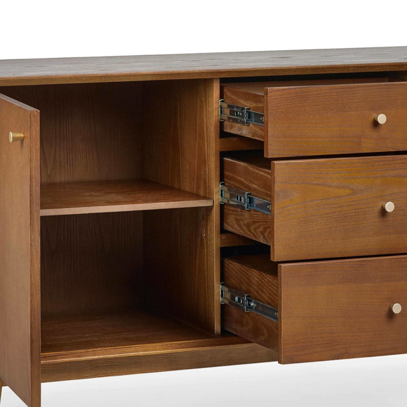 Wooden cabinet with open drawers on a white background