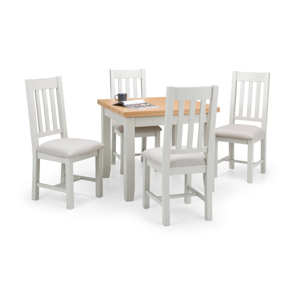 Dining set with a table and four chairs on a white background