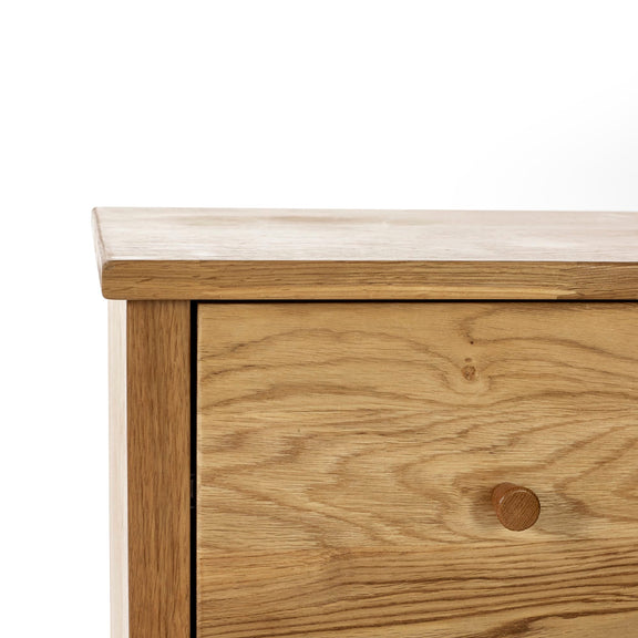 Wooden drawer with a white countertop on a white background