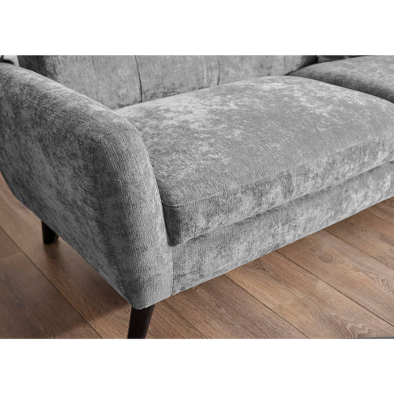 Gray textured sofa on a wooden floor