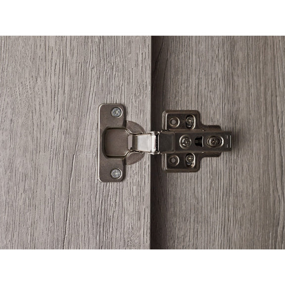 Close-up of a metal hinge on a wooden door