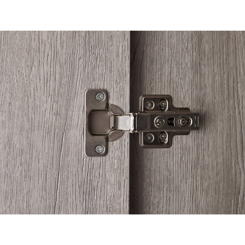 Close-up of a metal hinge on a wooden door