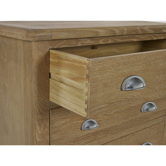 Wooden dresser with open drawer and metal handles on a white background