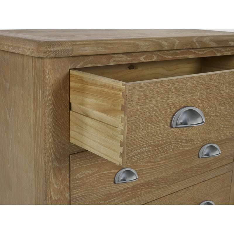 Wooden dresser with open drawer and metal handles on a white background
