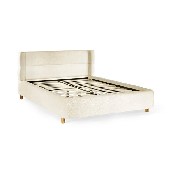 Beige upholstered bed frame on a white background