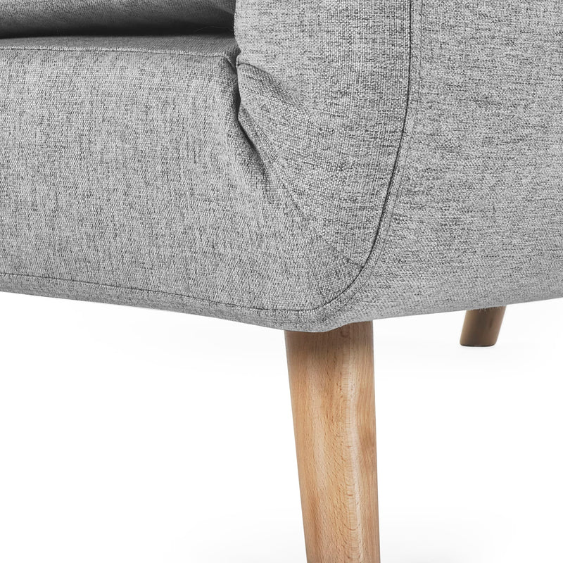 Gray upholstered chair with wooden legs on a white background