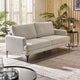 Gray sofa in a living room with plants and a side table.