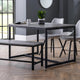 Dining area with a table, chairs, and bench on a wooden floor.