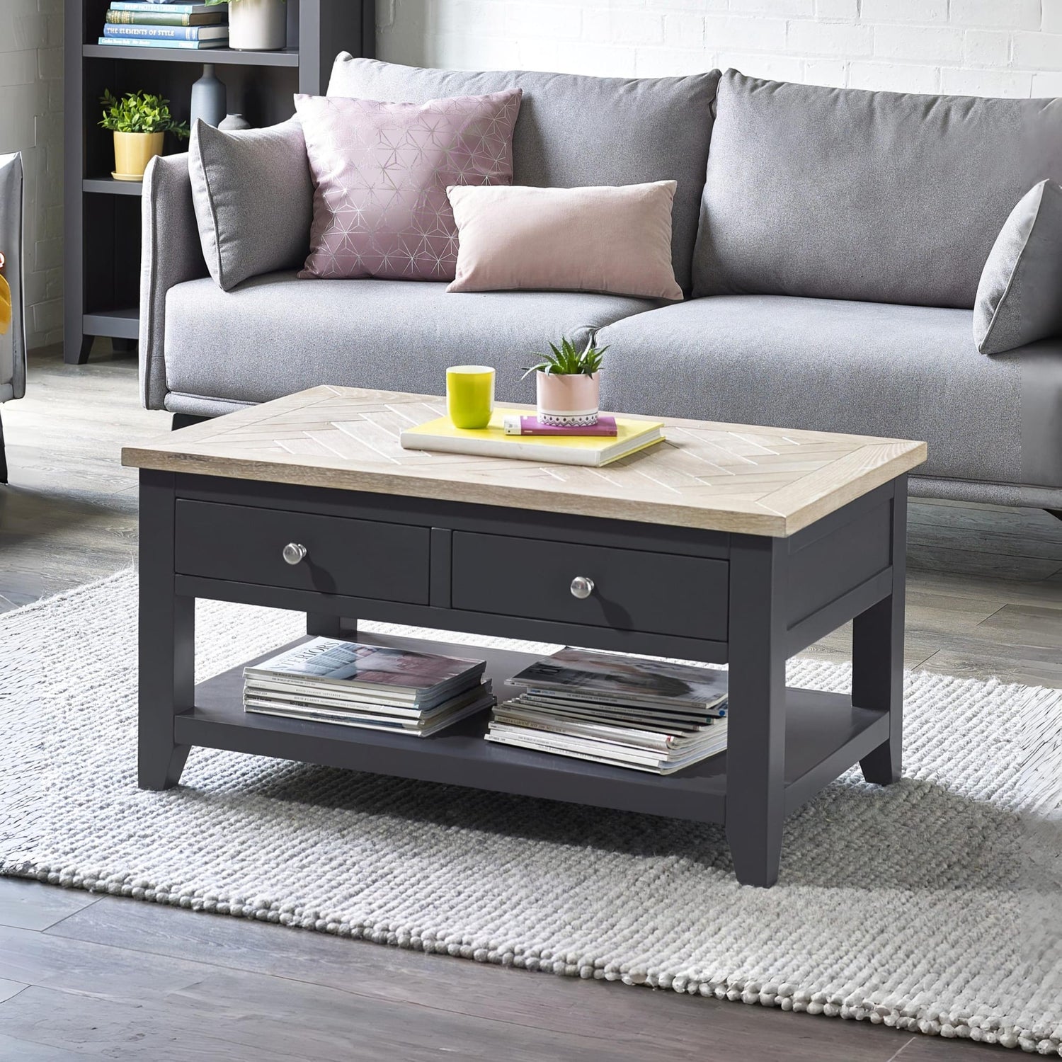 Gray coffee table with wooden top in a living room setting