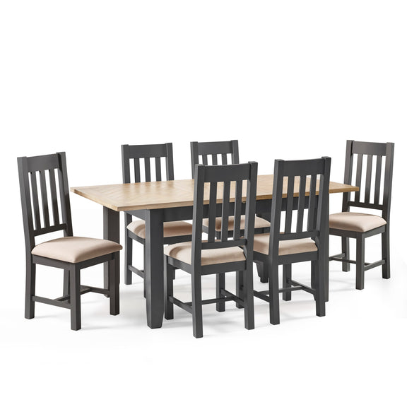 Dining table set with six chairs on a white background