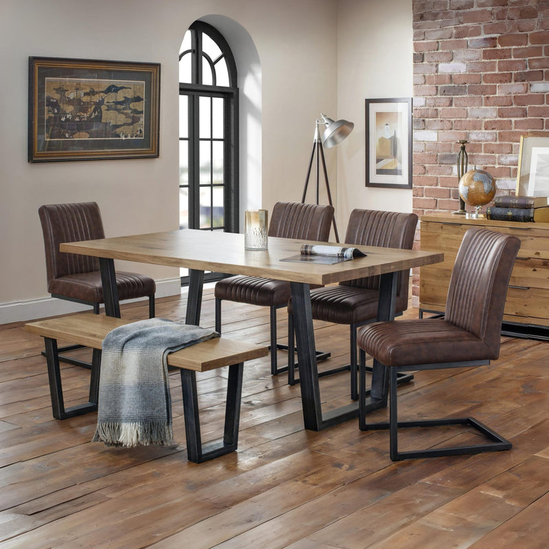 Dining room with wooden table and chairs in a home setting