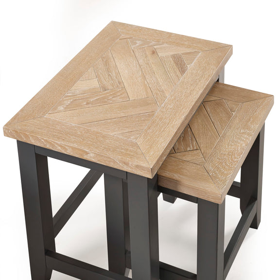 Wooden nesting tables with a geometric pattern on a white background